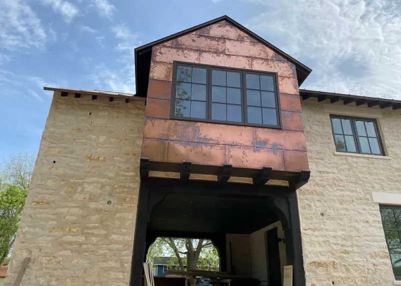 Copper metal panel facade on a stone building for Metal Roof Coating in Fort Myers