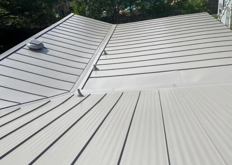 Solar attic fan installed on a metal roof for Roof Ventilation in Fort Myers